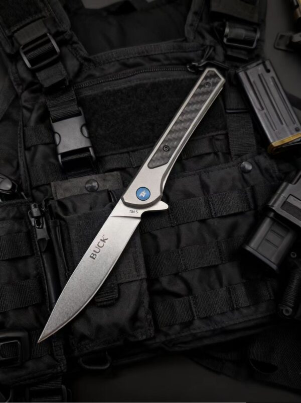 微信图片_20251028104334_209_1 Product Description A sleek, framelock folding knife that is the perfect choice for everyday carry. The 264 Cavalier pocket knife features a gray anodized aluminum handle with a carbon fiber inlay and a blue fastener. This slim knife utilizes ball bearing technology and a blade flipper for a smooth, seamless opening. A stonewashed finish, stainless steel pocket clip adds carry convenience. Closed length: 4 1/2" (11.4 cm). Imported