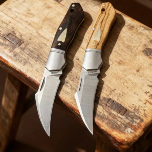 Model/Item/Part - BG041. Begg - Hawkbill Slip Joint Knife Black Handles. 3" (7.62cm) closed. 2.38" (6.05cm) satin finish 14C28N Sandvik stainless hawkbill blade. Yellow sandalwood and ebony handle. Stainless bolster(s). Inlay shield. Slip joint. Black nylon zippered storage case. Boxed. Made in China. Specifications